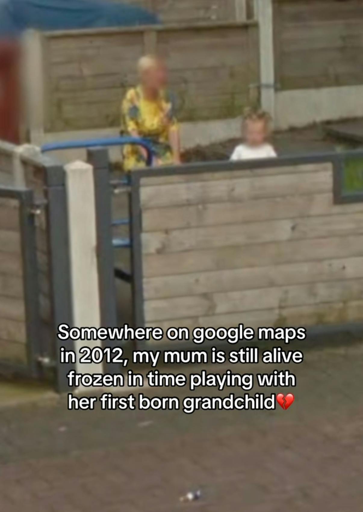 Somewhere on Google trend screenshot of a grandma and her grandchild playing in a yard. Text overlay reads, 'Somewhere on Google maps in 2012, my mum is still alive frozen in time playing with her first born grandchild (broken heard emoji)'