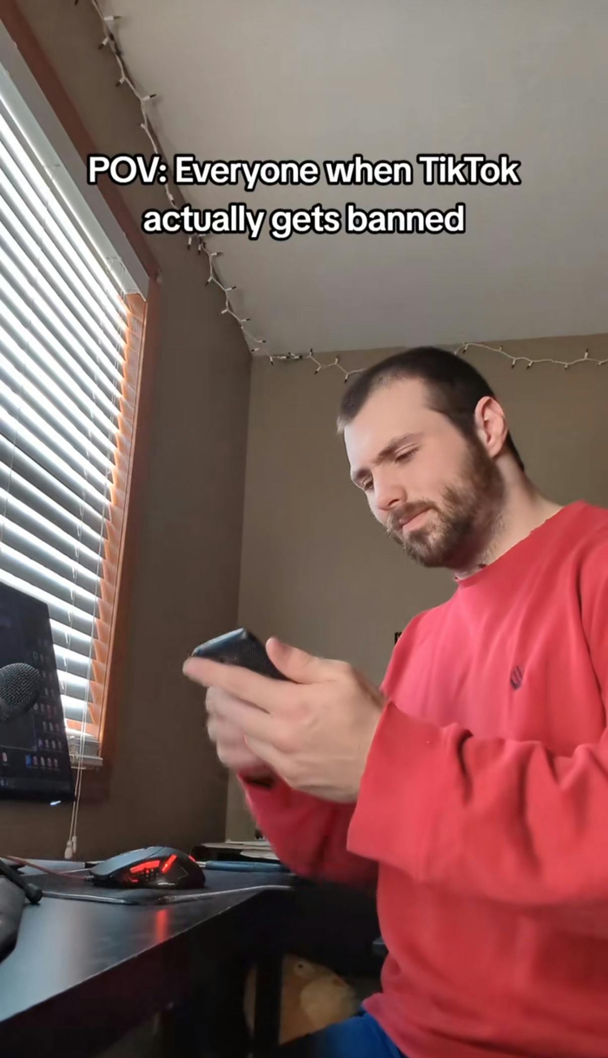 TikTok screenshot of a man frantically tapping at his phone because TikTok stops working. Text overlay reads, 'POV: Everyone when TikTok actually gets banned.'