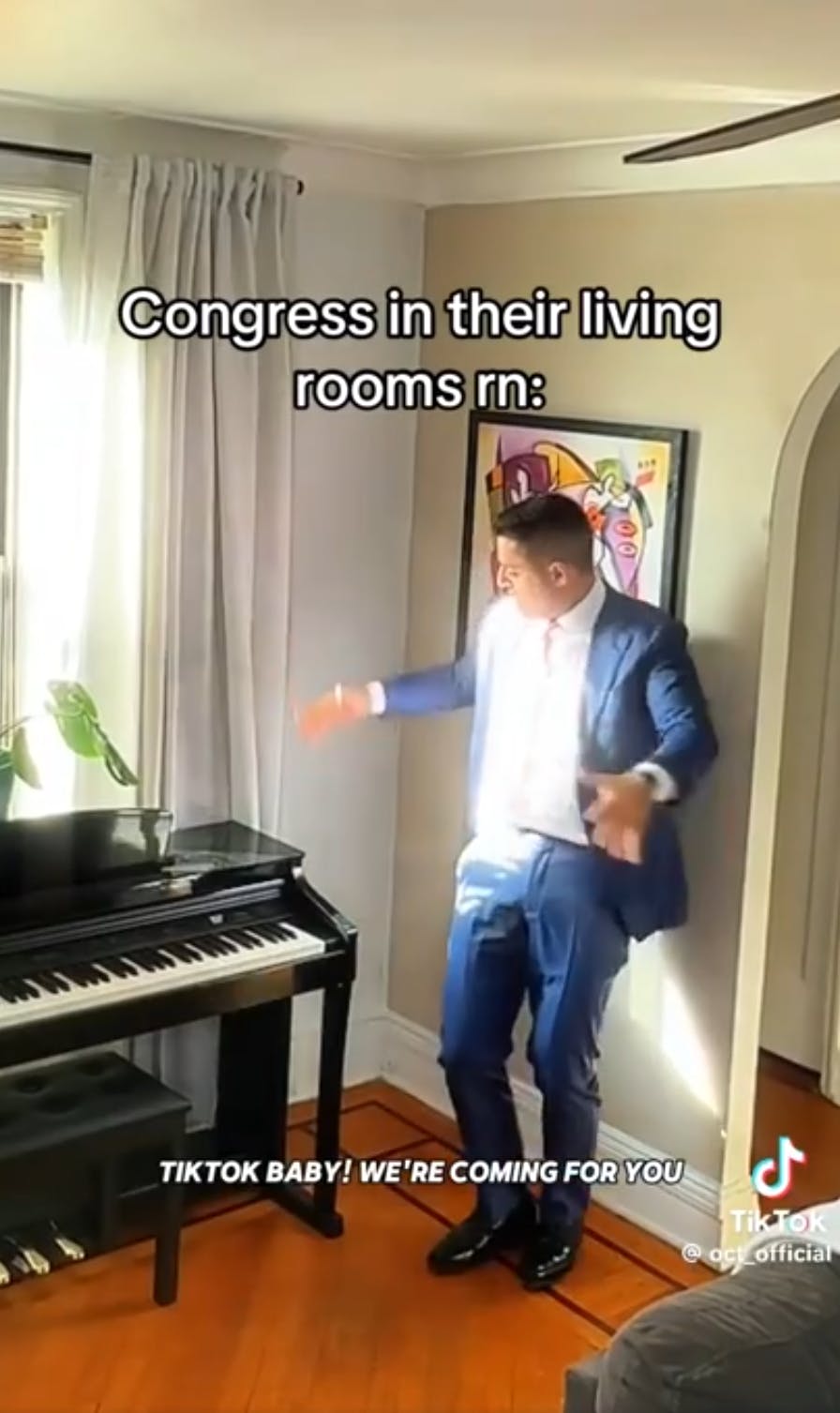 TikTok screenshot of a man in a suit dancing next to a piano. Text overlay reads, 'Congress in their living rooms rn: 'TikTok baby! We're coming for you.''