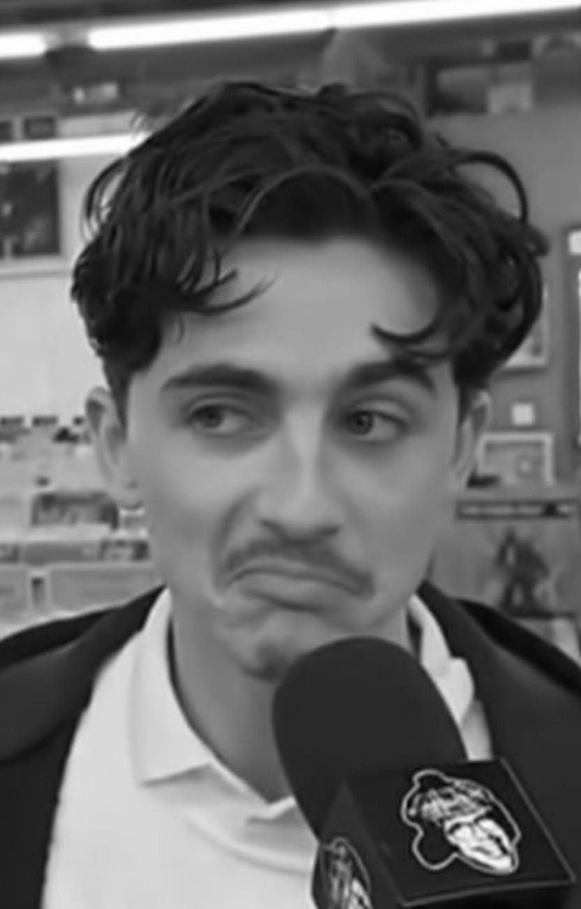 timothee chalamet frowning meme in black and white