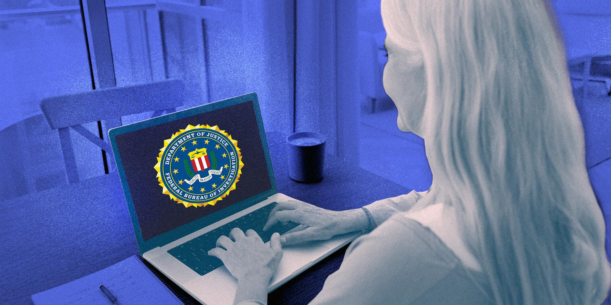 Elderly women using a laptop that is displaying the seal of the U.S Federal Bureau of Investigation.