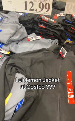 Still from a video in Costco showing off the Scuba dupes they have available for $12.99. Text overlay reads, "Lululemon Jacket at Costco???"