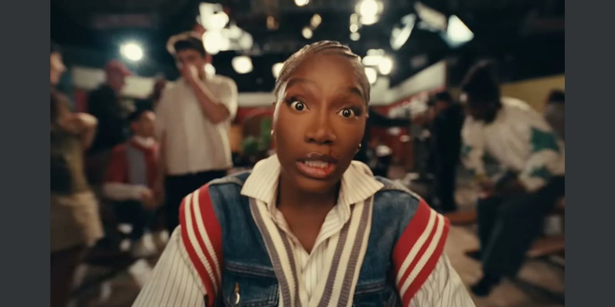 Still image from the music video 'Denial is a River' showing the musical artist Doechii.