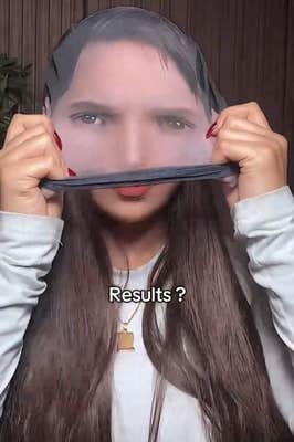 Lionel Messi face mask TikTok video showing a woman in the middle of putting one on.