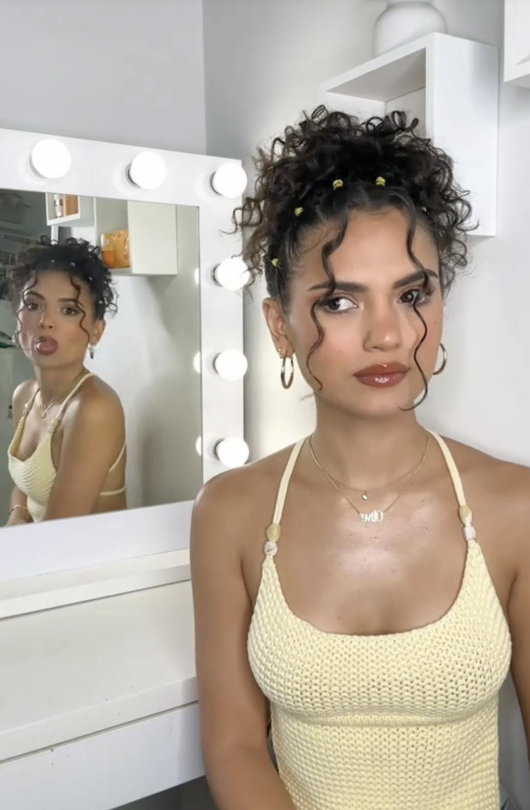 a woman using/doing the Anxiety Mirror trend/challenge