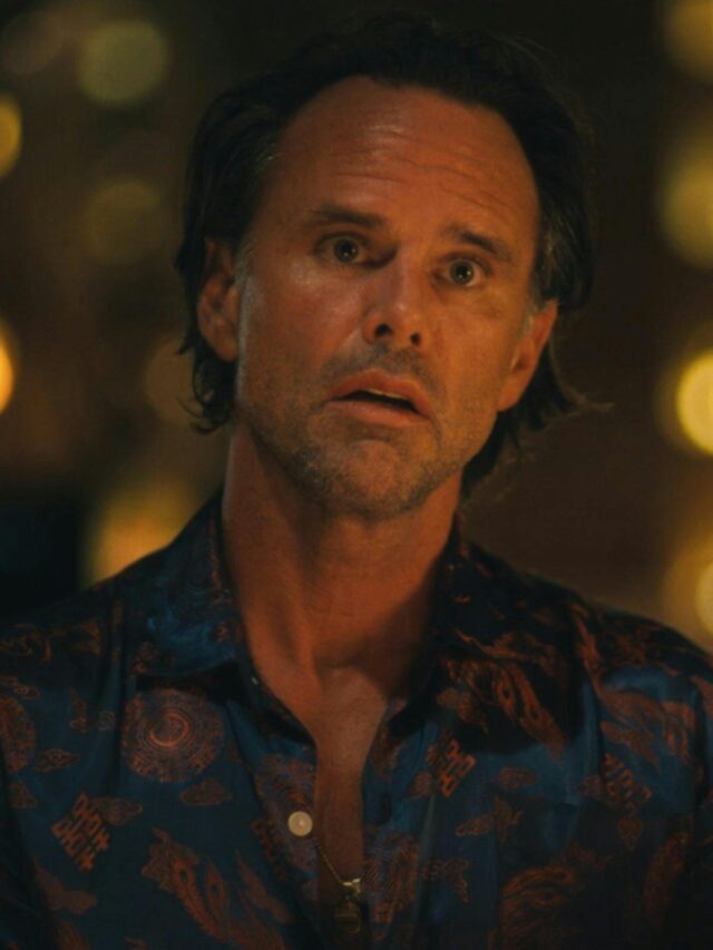 Rick Hatchett from The White Lotus staring with wide eyes and an open mouth.