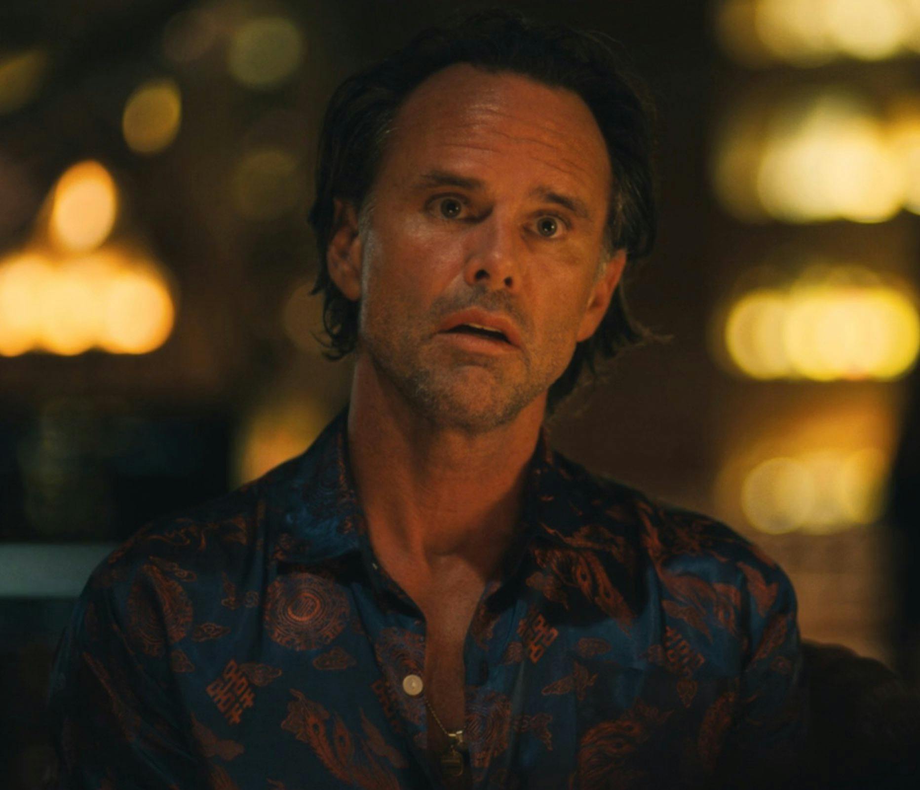 Rick Hatchett from The White Lotus staring with wide eyes and an open mouth.