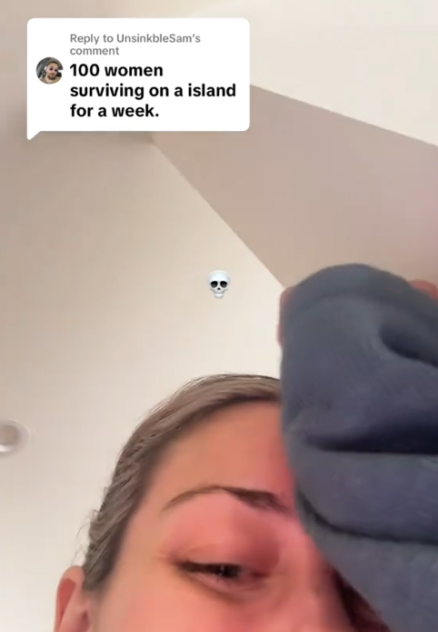 A women laughing in a TikTok video under a comment reading '100 women surviving on a island for a week,'