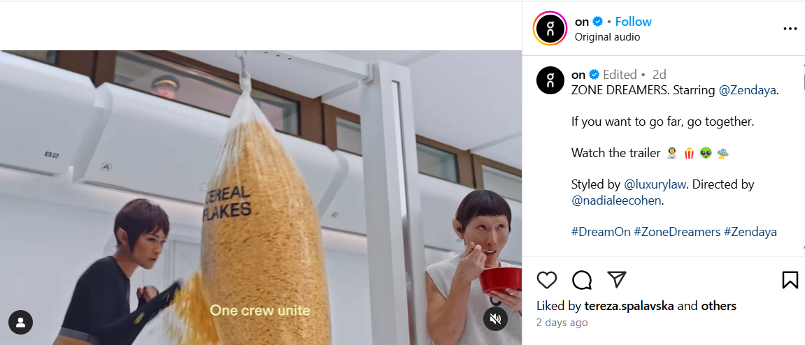 Screenshot of a video from Instagram showing Zendaya punching a bag of cereal food in fashion status symbol