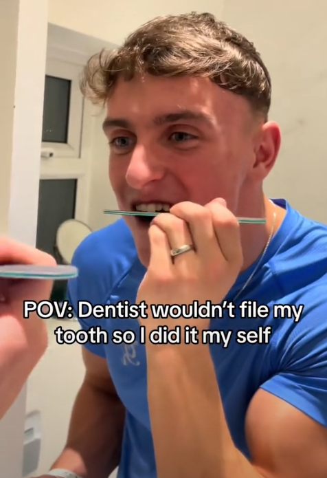 TikTok video showing a young man filing his teeth with a nail file in the mirror.