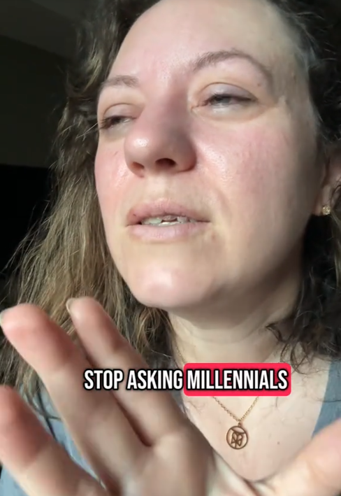 A woman speaking with her hand up saying 'stop asking millennials.'
