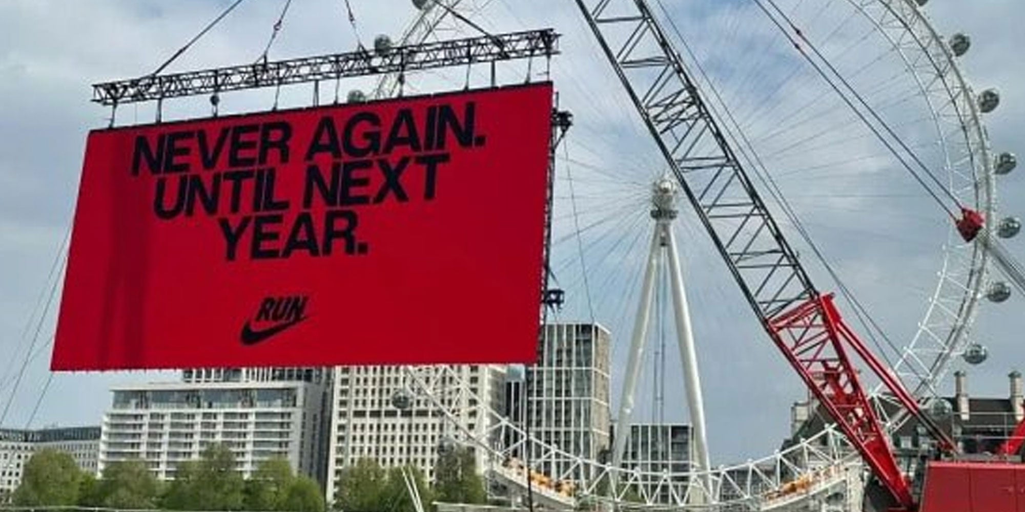 Photo from X user @Ostrov_A of a sign in front of the London Eye that reads 'Never Again. Until Next Year.'