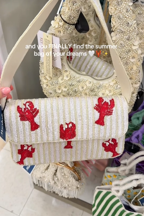 TikTok video showing a lobster beaded bag in a store display.