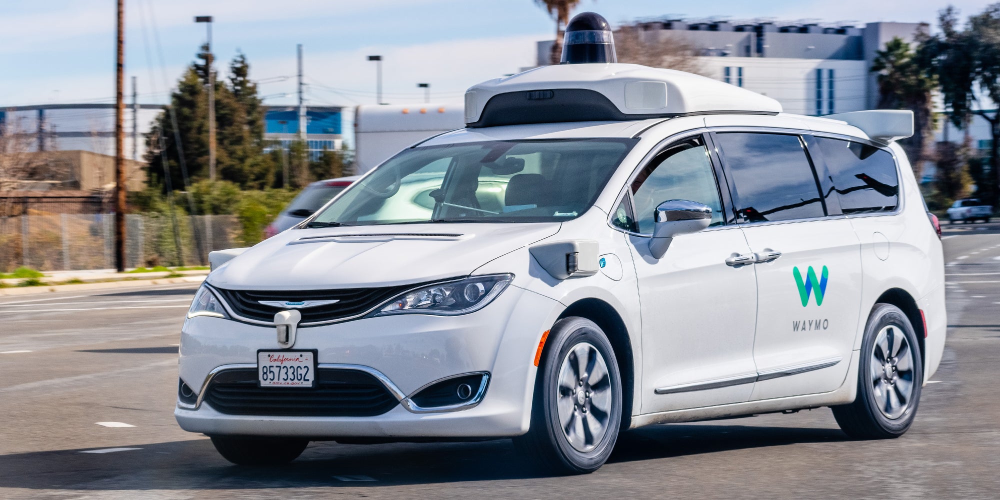 A Waymo self-driving vehicle cruises the streets of California.