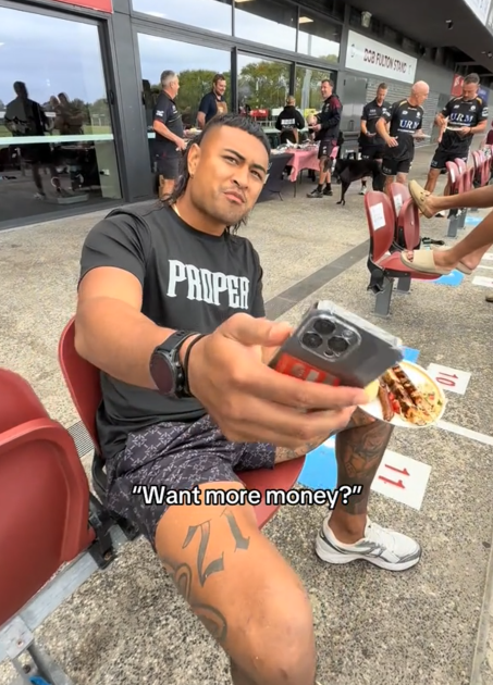 TikTok video of a man holding out his phone and saying 'Want more money?'