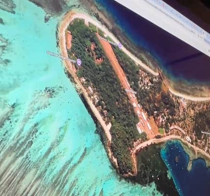 @melanieroseu/TikTok ever wonder where Survivor is filmed?? satellite photos of an island with production vehicles on the set of Survivor