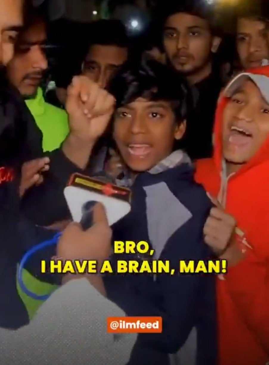 Muslim Indian boy saying 'Bro, I have a brain, man!' into a reporter's mic.