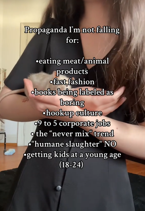 Propaganda I'm not falling for TikTok video with a woman holding a pet rat.