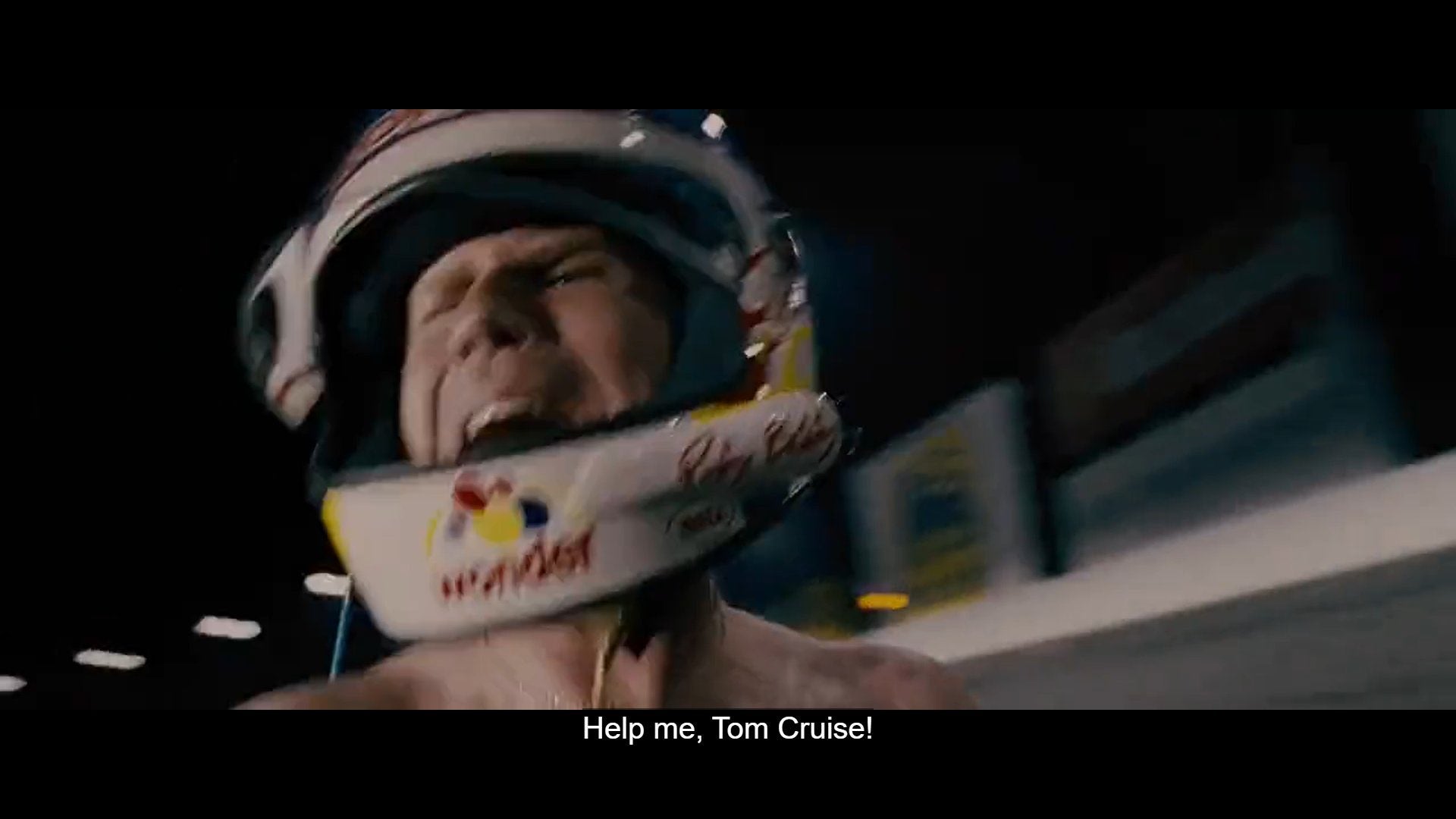 Screenshot from Talladega Nights: The Ballad of Ricky Bobby with Will Farrell yelling 'Help me, Tom Cruise!'