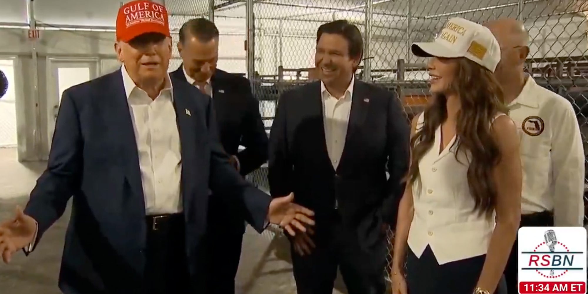 President Donald Trump touring new detainment facility 'Alligator Alcatraz' and laughing alongside Florida Governor Ron DeSantis and Homeland Security Secretary Kristi Noem.