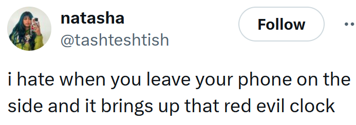 Tweet reading 'i hate when you leave your phone on the side and it brings up that red evil clock'