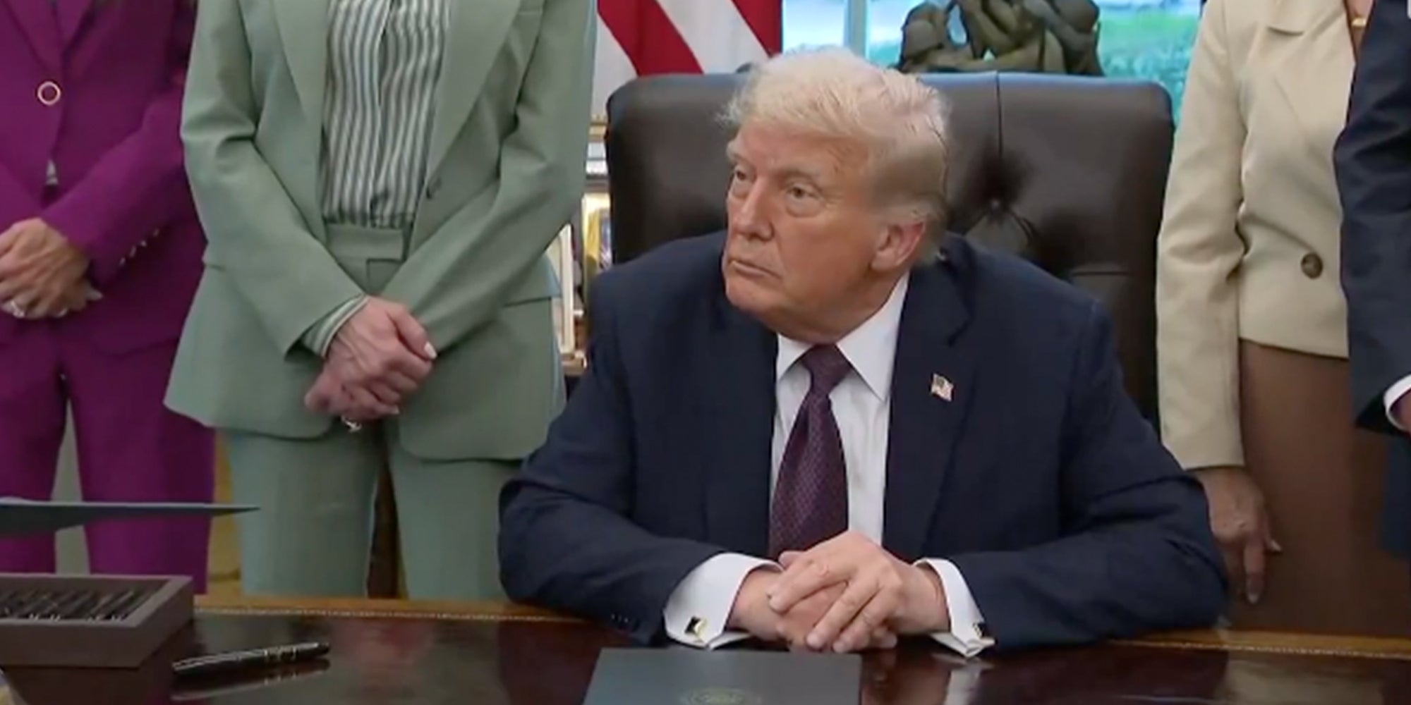 Donald Trump sitting behind his desk in the Oval Office answering a question about former Minnesota House Speaker Melissa Hortman.