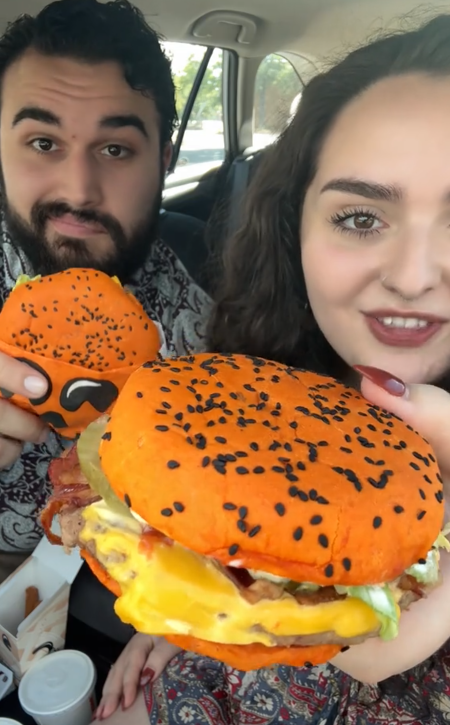 TikTok video of a couple in their car about to try the Jack-O-Lantern Whopper.