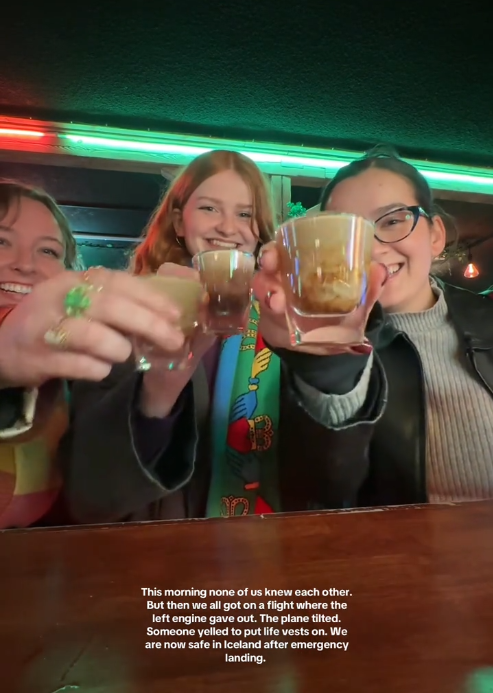 TikTok video of three woman toasting shots in a bar for the camera.