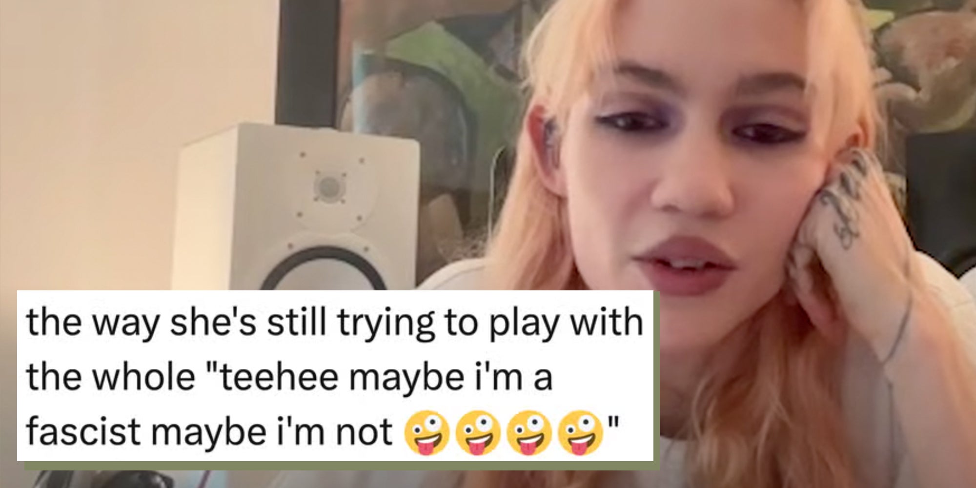 Musician Grimes looking into the camera. Text overlay reads, the way she's still trying to play with the whole 'teehee maybe i'm a fascist maybe i'm not.'