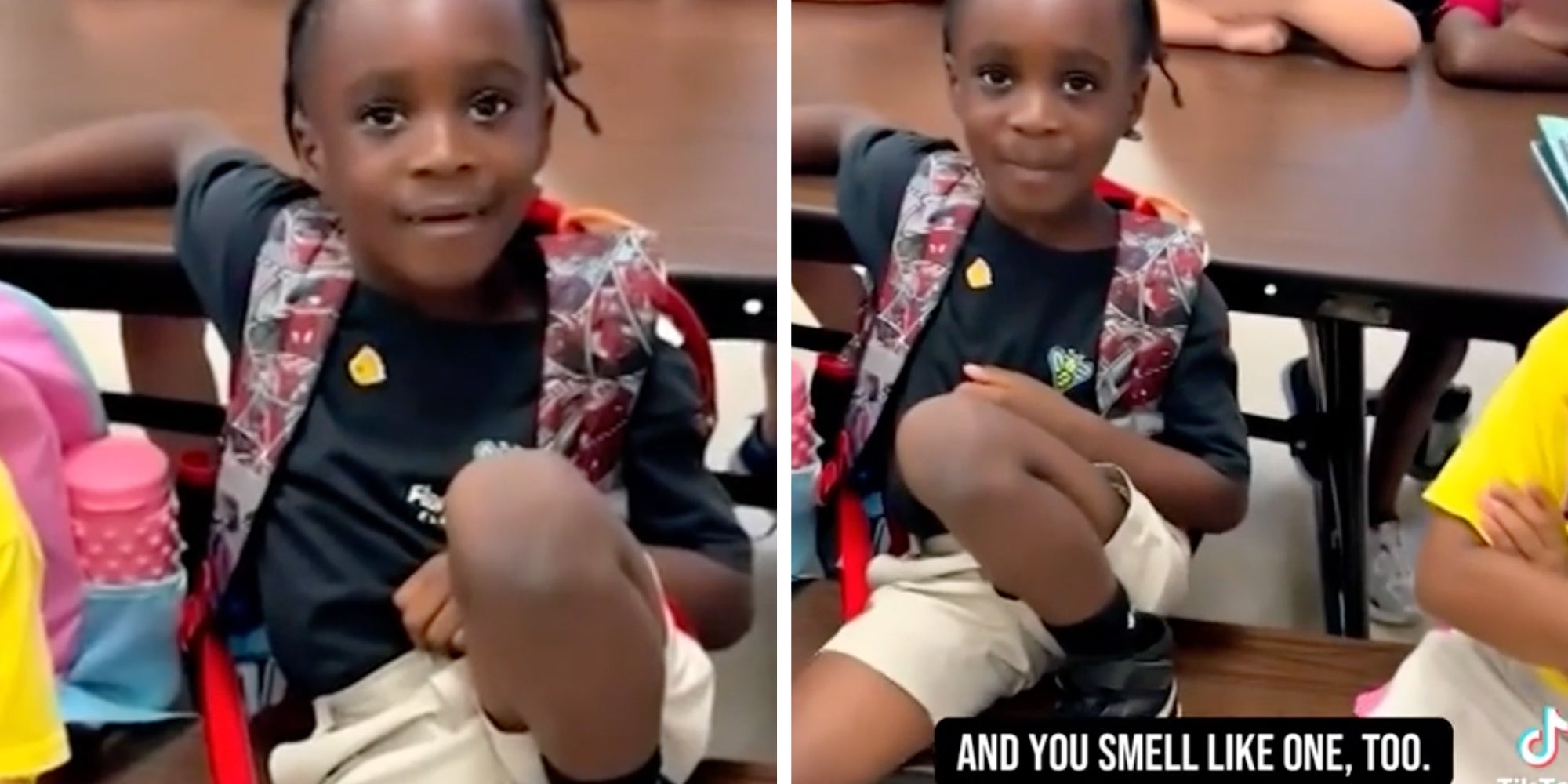 Small child in school wearing a backpack.