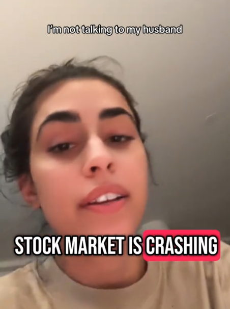 TikTok video of a woman saying 'stock market is crashing' to the camera with a caption reading 'I'm not talking to my husband.'