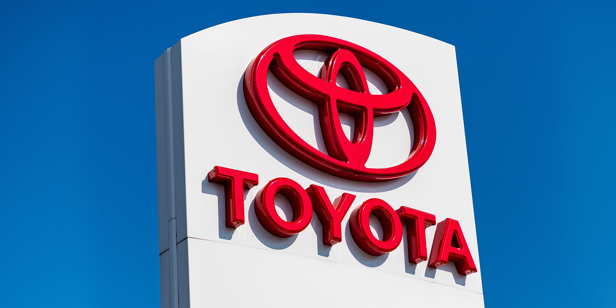 Toyota dealership. Toyota car logo sign. Luxury car brand of Toyota. Auto logo of Toyota brand. Luxury car brand logo. Car dealership center