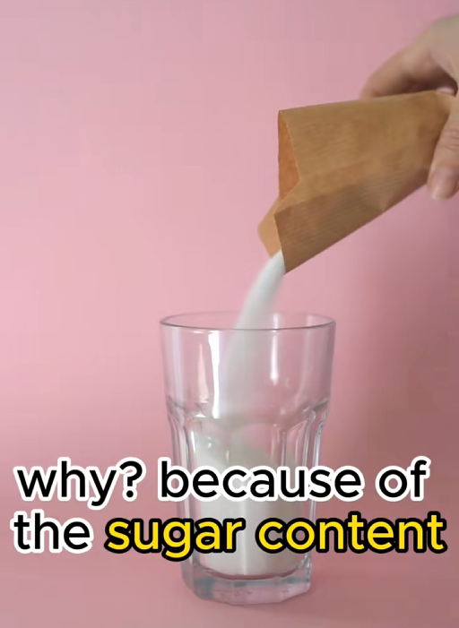TikTok video graphic showing someone pouring sugar into a class with a caption reading 'why? because of the sugar content.'