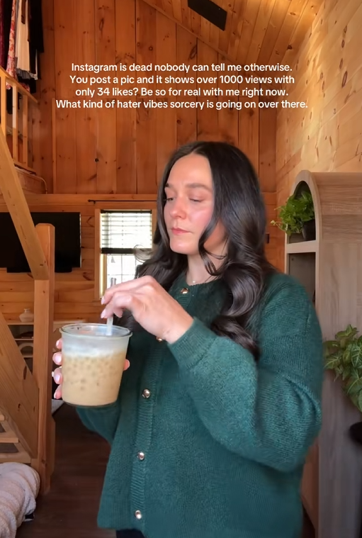 TikTok video of a woman stirring her bubble tea with a caption reading 'Instagram is dead nobody can tell me otherwise. You post a pic, and it shows over 1,000 views with only 34 likes? Be so real with me right now. What kind of hater vibes sorcery is going on over there?'