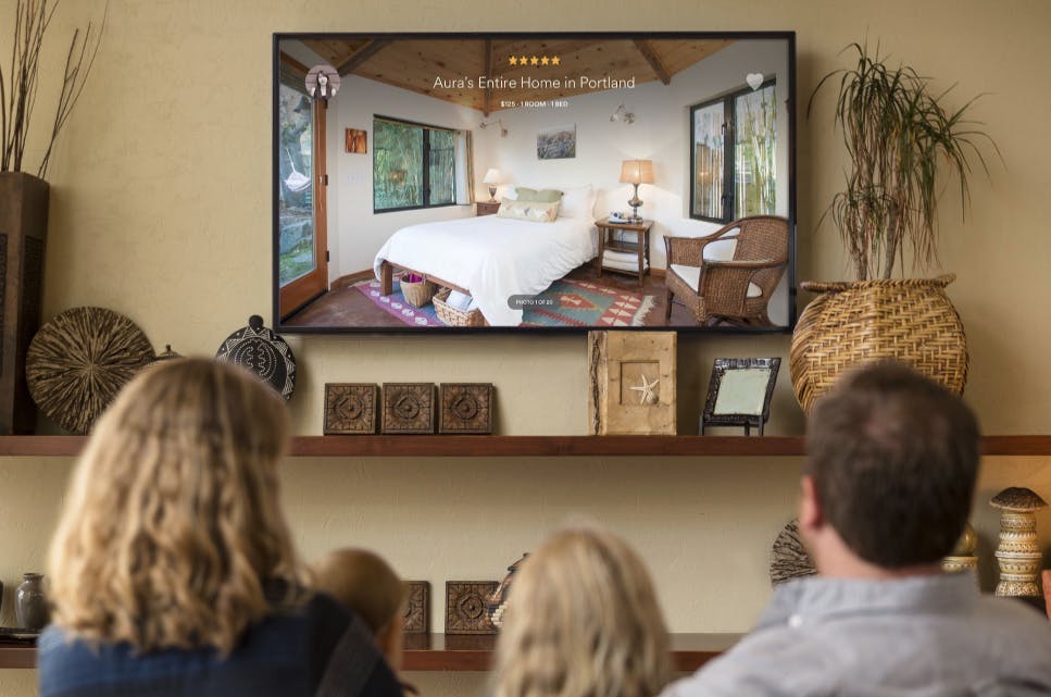 Family looking at Airbnb on Apple TV