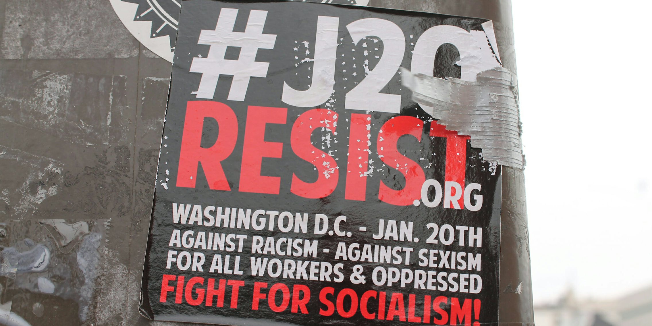 Flyer for #J20 resist.org on light pole