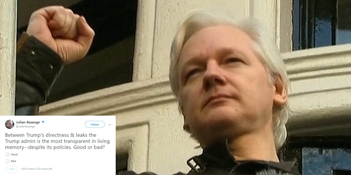 Julian Assange raising his fist outside Ecuadoran embassy