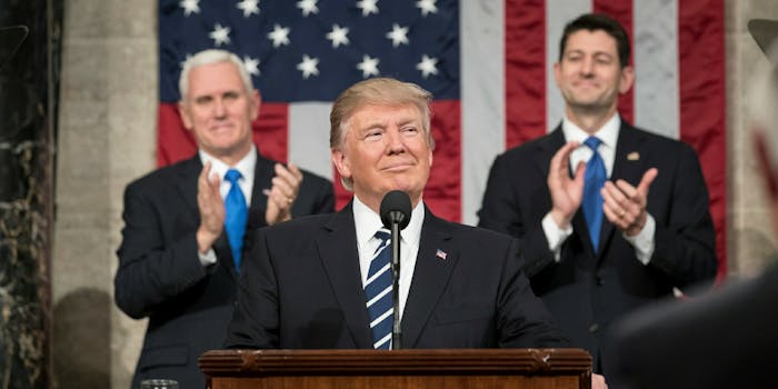 President Donald Trump addressing Congress, with Mike Pence and Paul Ryan behind him.