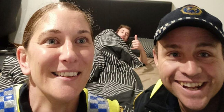 Australian police take selfie with a drunk man in his bed