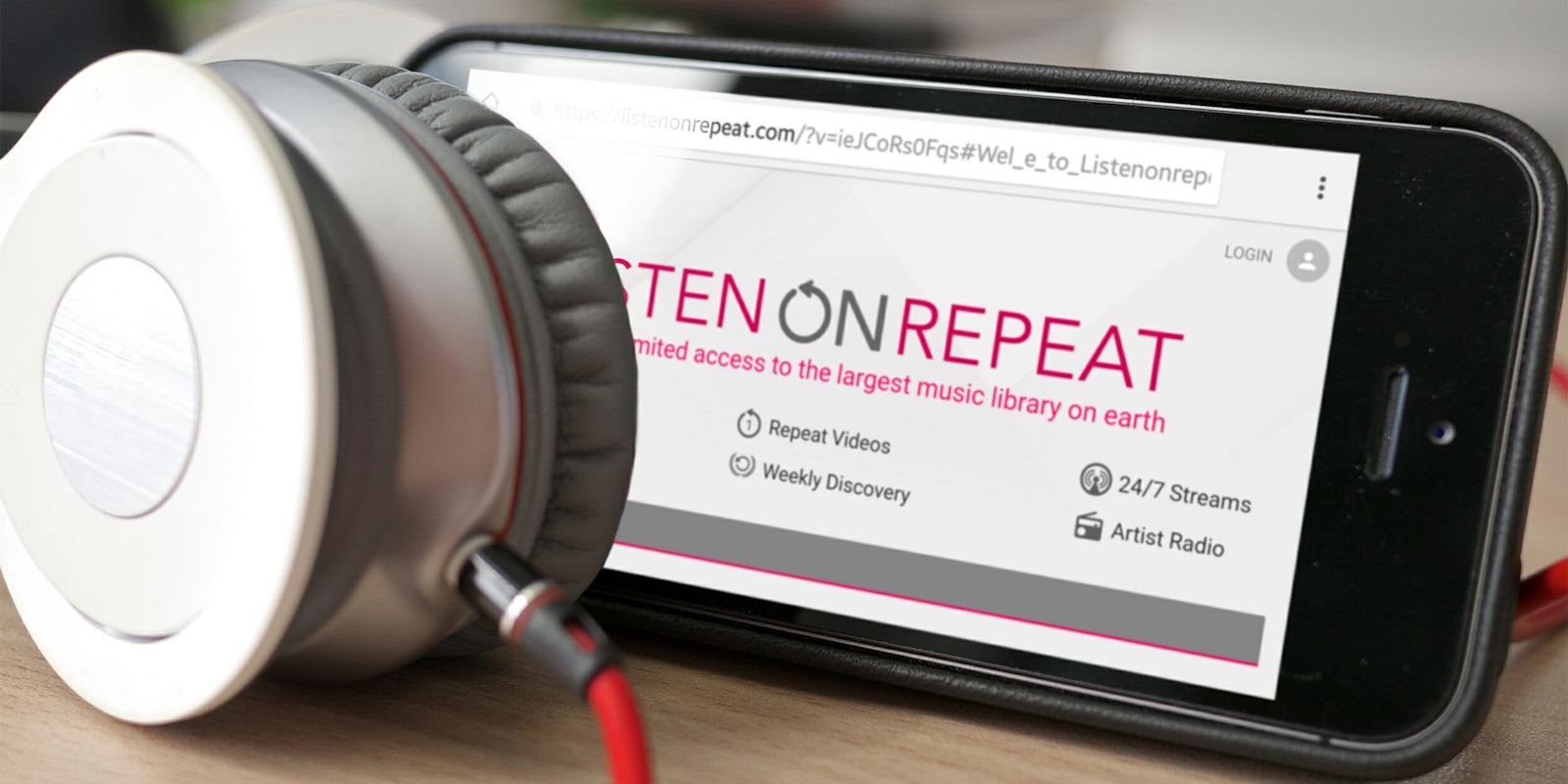 Listen On Repeat website on phone, behind headphones