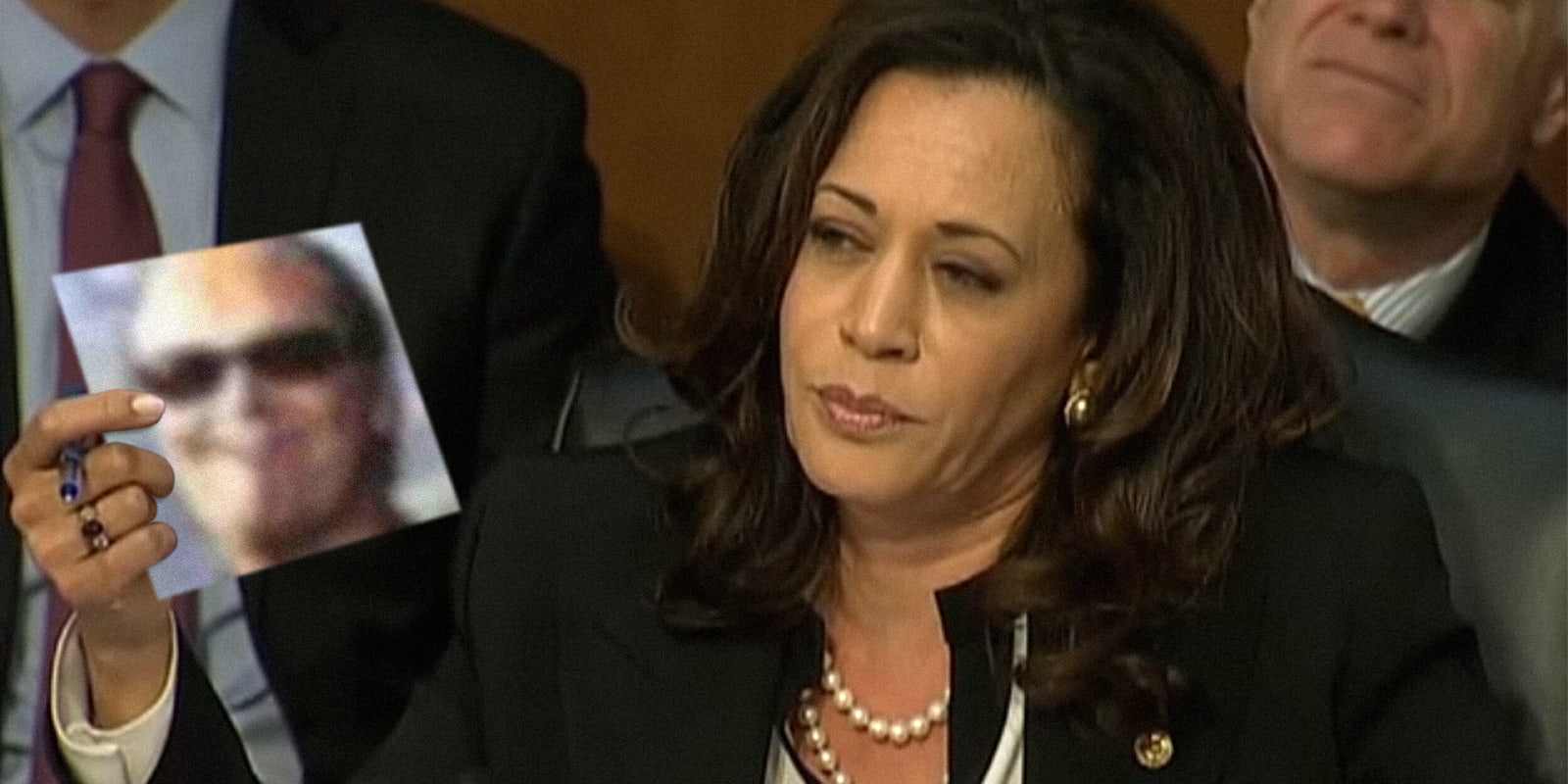 Kamala Harris holding picture of Twitter user dril