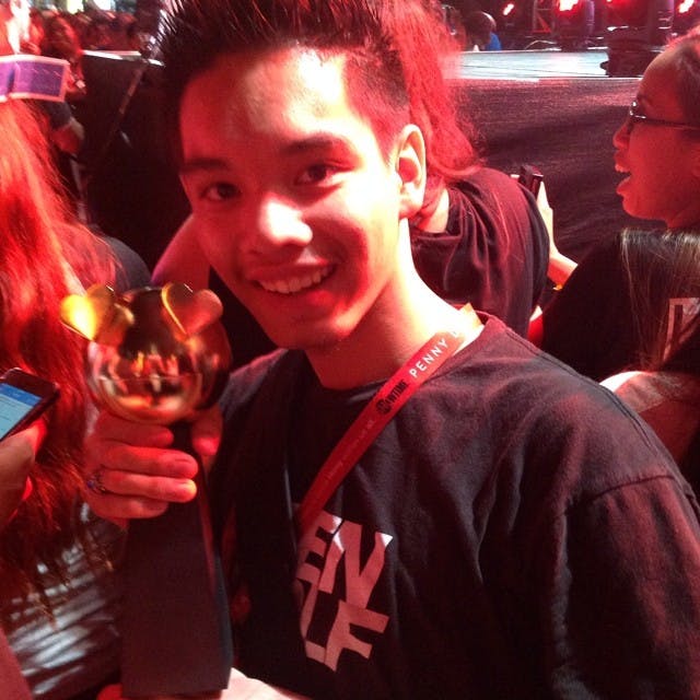 Tyler Villegas smiling and posing as he holds the award for MTV Fandom Feat of the Year at the MTV Awards last night.