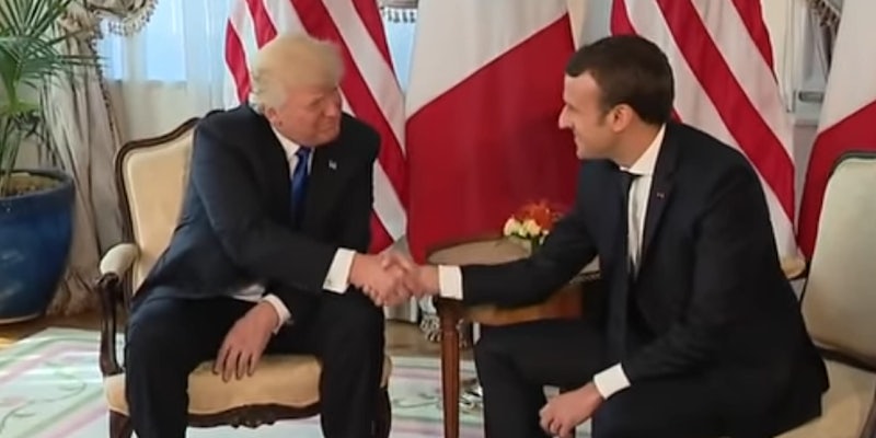 Trump and Macron shake hands.
