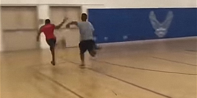 Man about to faceplant into metal door during gym race