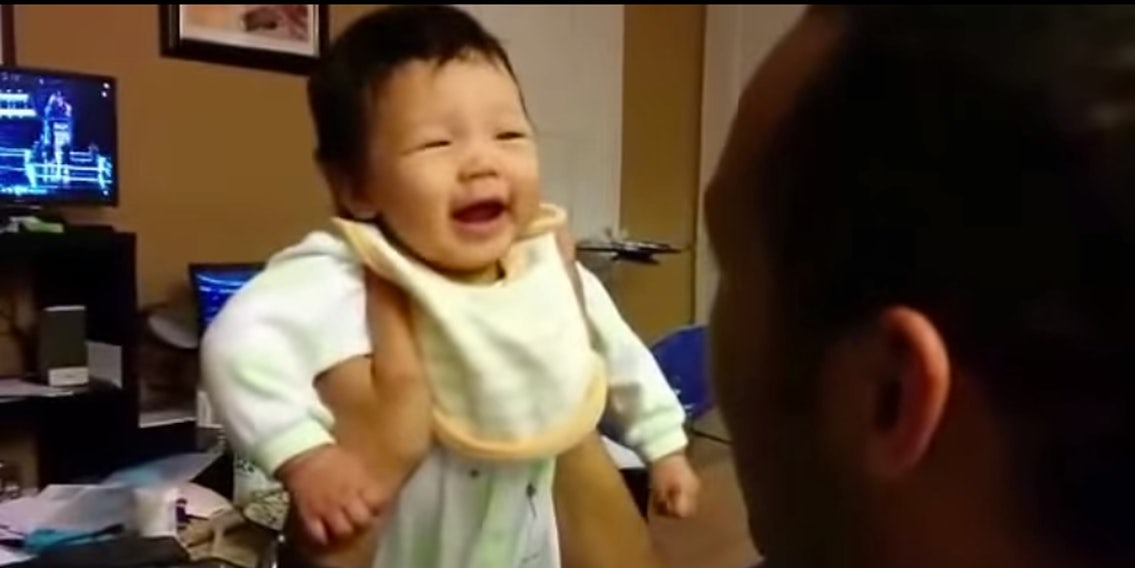 Dad and newborn are caught in the world's best giggle loop - The Daily Dot