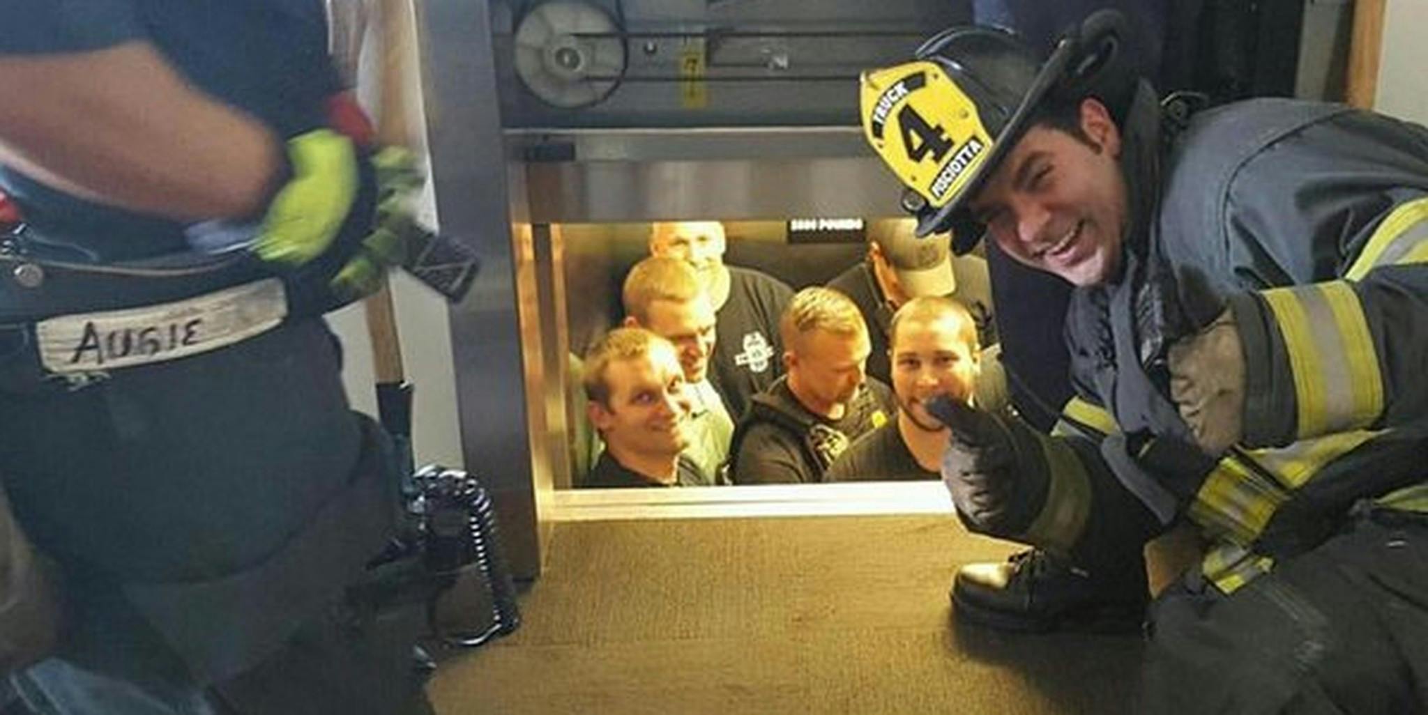 Embarrassed police saved from stuck elevator by rival firefighters