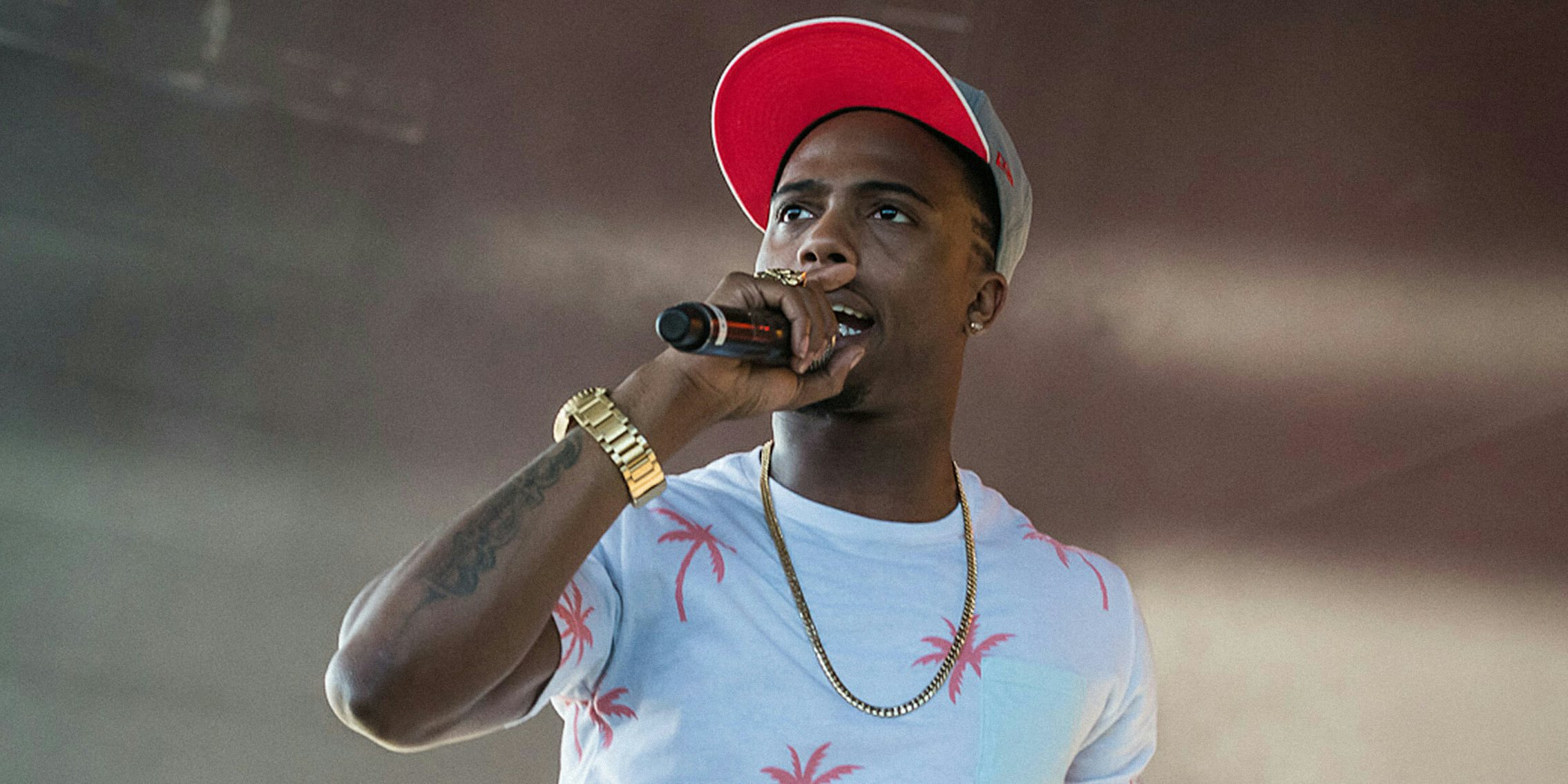 B.o.B. with microphone on stage