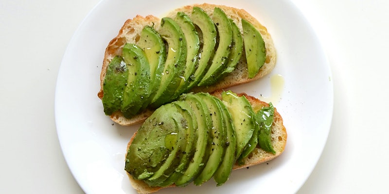 Sliced avocado on toasted bread