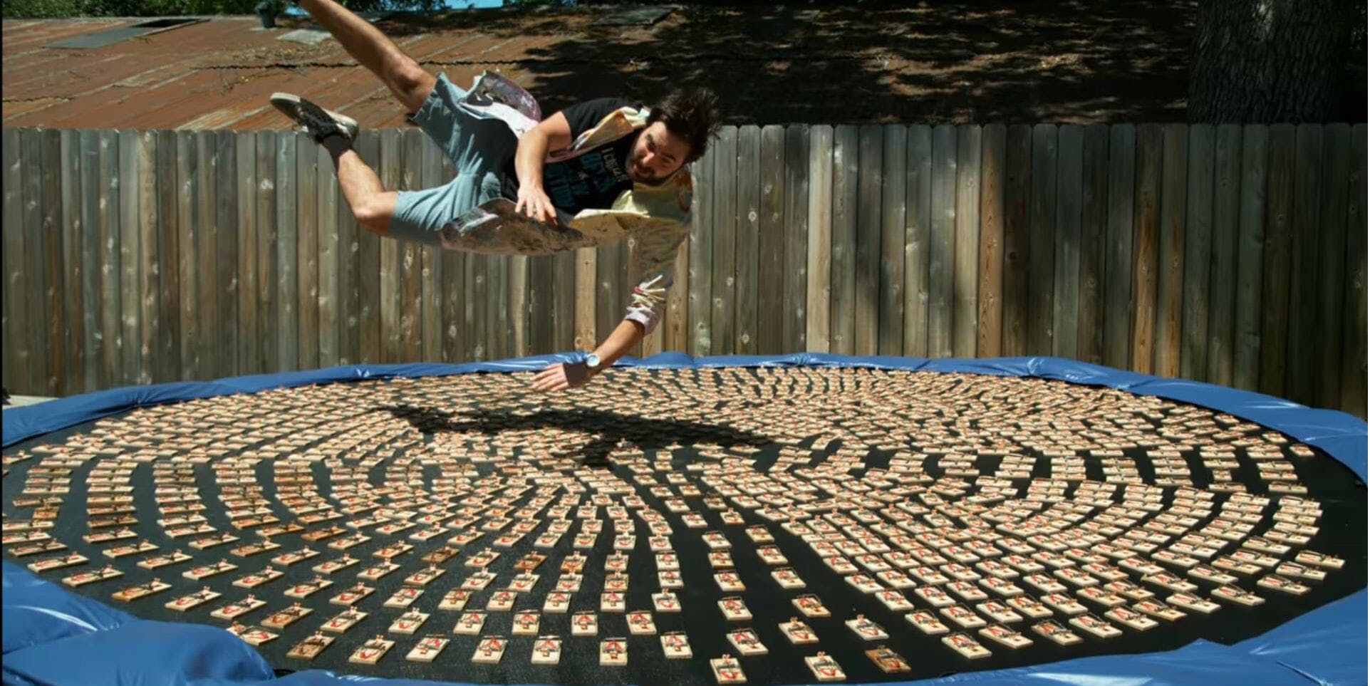 Watch Horror Dude Jumps On a Trampoline With 1,000 Mouse Traps