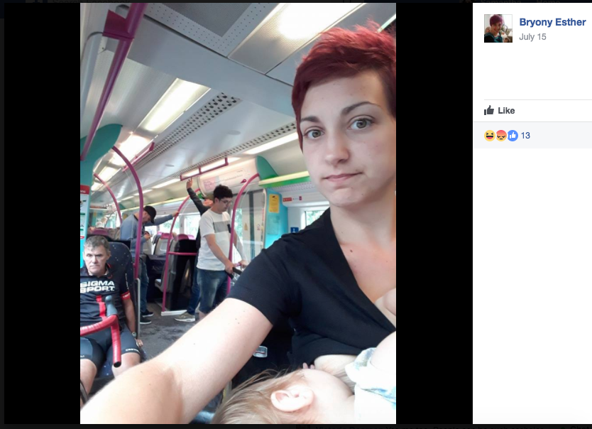 A breastfeeding woman on a packed train